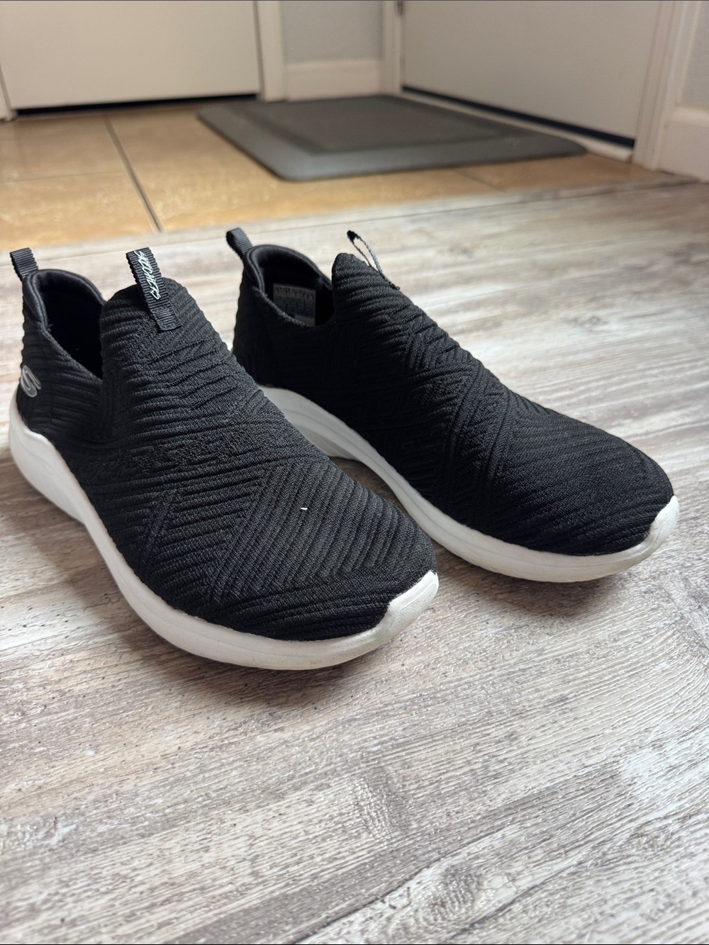 Skechers Women’s Black Slip-On Knit Sneakers with White Sole